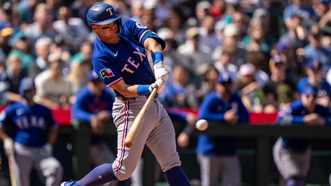 Texas Rangers third baseman Josh Jung (6) hits a RBI-sacrifice fly. 