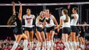 Aug 30, 2023; Lincoln, NE, USA; Nebraska Cornhuskers outside hitter Ally Batenhorst (14) celebrates with her teammates after scoring against the Omaha Mavericks during the third set at Memorial Stadium.