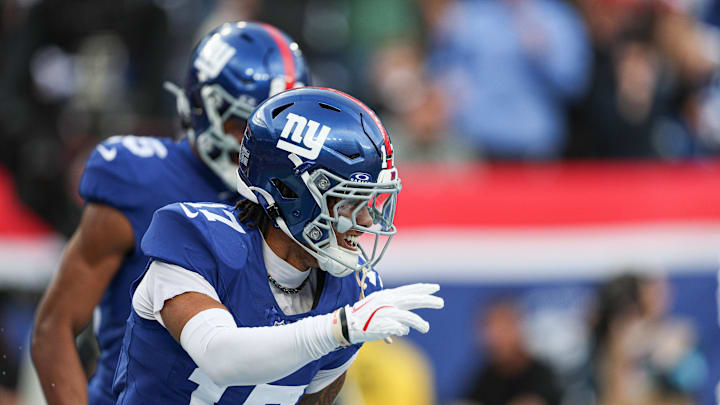 Dec 29, 2024; East Rutherford, New Jersey, USA; New York Giants wide receiver Wan'Dale Robinson (17) celebrates his touchdown reception during the first half against the Indianapolis Colts at MetLife Stadium.