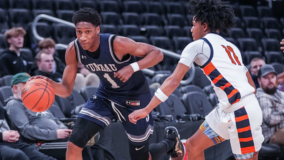 Milwaukee Juneau's Dooney Johnson (1) races Racine Park's Jwan Eastland (11) downcourt during a Deer District Prep Showcase game at Fiserv Forum in Milwaukee, WI. on Saturday, Feb. 8, 2025. Milwaukee Juneau's Dooney Johnson (1) races Racine Park's Jwan Eastland (11) downcourt during a Deer District Prep Showcase game at Fiserv Forum in Milwaukee, WI. on Saturday, Feb. 8, 2025.