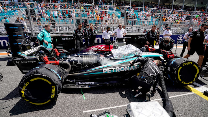 May 4, 2024; Miami Gardens, Florida, USA; Crewmembers of the Mercedes driver George Russell (63) cool the car on the grid before the F1 Sprint Race at Miami International Autodrome. Mandatory Credit: John David Mercer-Imagn Images