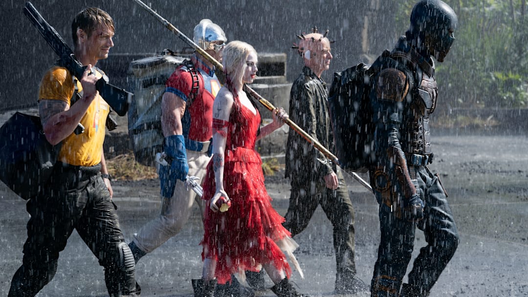 (L-r) JOEL KINNAMAN as Rick Flag, JOHN CENA as Peacemaker, MARGOT ROBBIE as Harley Quinn, PETER CAPALDI as The Thinker and IDRIS ELBA as Bloodsport in Warner Bros. Pictures’ action adventure “THE SUICIDE SQUAD,” a Warner Bros. Pictures release.. Photo: Jessica Miglio/™ & © DC Comics. © 2021 Warner Bros. Entertainment Inc. All Rights Reserved.