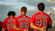 Boston's top-three prospects in Marcelo Mayer, Kristian Campbell and Roman Anthony stand for the national anthem ahead of a Spring Training breakout game on March 13, 2025.