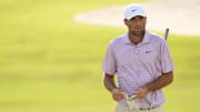 Scheffler walks up onto the 18th green during the first round of the TOUR Championship golf tournament.