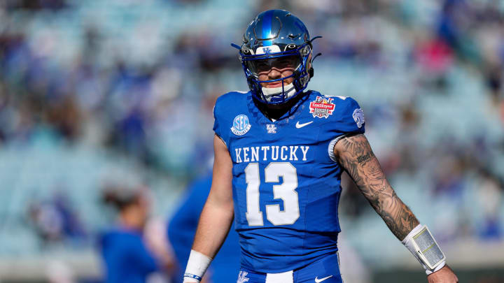 Dec 29, 2023; Jacksonville, FL, USA;  Kentucky Wildcats quarterback Devin Leary (13) warms up before a game against the Clemson Tigers  the Gator Bowl at EverBank Stadium. Mandatory Credit: Nathan Ray Seebeck-USA TODAY Sports