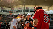 Red Sox prospect Marcelo Mayer signs autographs following a Spring Training game at JetBlue Park on March 11, 2025.