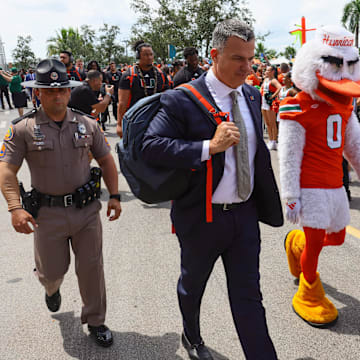 Sep 14, 2024; Miami Gardens, Florida, USA; Miami Hurricanes head coach Mario Cristobal arrives at Hard Rock Stadium before a game against the Ball State Cardinals. Mandatory Credit: Sam Navarro-Imagn Images