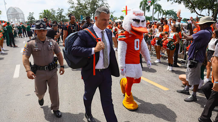 Sep 14, 2024; Miami Gardens, Florida, USA; Miami Hurricanes head coach Mario Cristobal arrives at Hard Rock Stadium before a game against the Ball State Cardinals. Mandatory Credit: Sam Navarro-Imagn Images