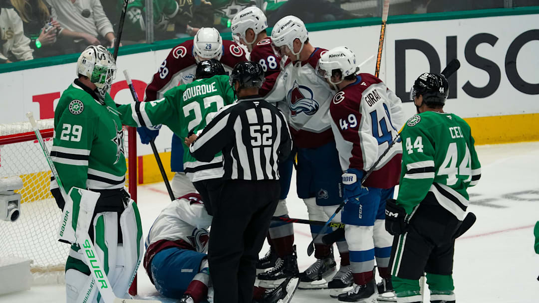 Apr 19, 2025; Dallas, Texas, USA; Colorado Avalanche left wing Artturi Lehkonen (62) is helped up by teammates after scoring a goal during the second period in game one of the first round of the 2025 Stanley Cup Playoffs against the Dallas Stars at American Airlines Center. Mandatory Credit: Raymond Carlin III-Imagn Images