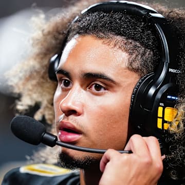 Oct 20, 2023; Carrollton, GA, USA; Carrollton Trojans quarterback Julian Lewis (10) watches on from the sidelines against the Westlake Lions during the first half at Grisham Stadium. The 15-year-old Carrollton High student has already committed to playing for the University of Southern California Trojans and has been considered one of the top high school quarterback prospects. Mandatory Credit: John David Mercer-Imagn Images