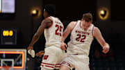 Nov 27, 2025; San Diego, CA, USA; Wisconsin Badgers forward Austin Rapp (22) reacts with Wisconsin Badgers guard John Blackwell (25) after scoring against the Providence Friars during the first half at Jenny Craig Pavilion. 
