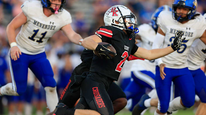 Bishop Kenny's JP Donovan (2) rushes for yards during the first quarter of a high school football matchup Monday, Oct. 14, 2024 at Bishop Kenny High School in Jacksonville, Fla. The Bishop Kenny Crusaders held off the Menendez Falcons 17-10. [Corey Perrine/Florida Times-Union]