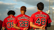 Boston's top-three prospects in Marcelo Mayer, Kristian Campbell and Roman Anthony stand for the national anthem ahead of a Spring Training breakout game on March 13, 2025.