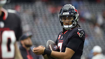 Jan 11, 2025; Houston, Texas, USA; Houston Texans quarterback C.J. Stroud (7) warms up prior to the game against the Los Angeles Chargers in an AFC wild card game at NRG Stadium. Mandatory Credit: Troy Taormina-Imagn Images