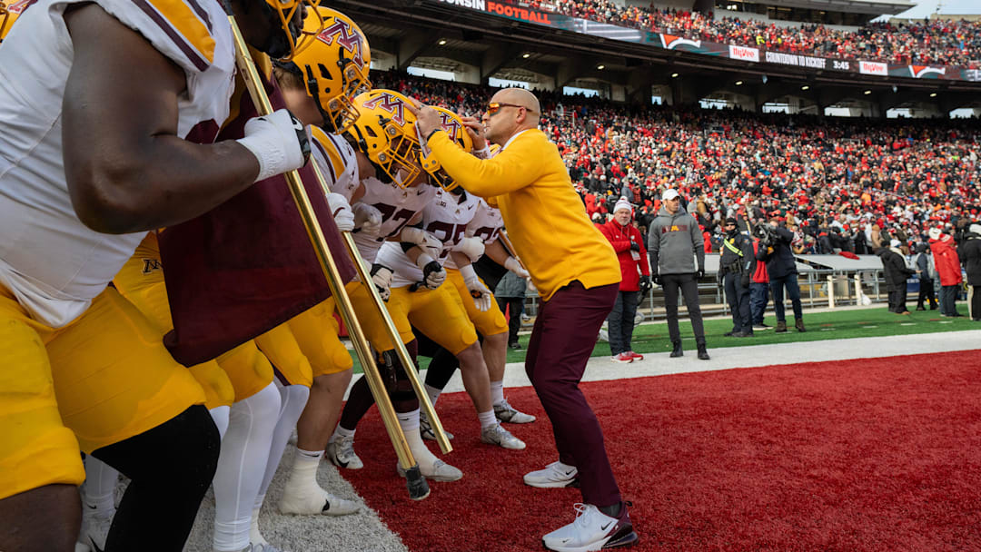 Minnesota head coach P.J. Fleck is shown with his team before their game at Camp Randall Stadium