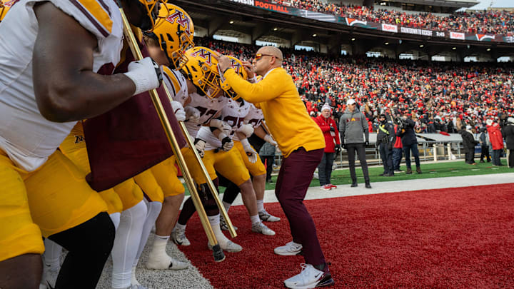 Minnesota head coach P.J. Fleck is shown with his team before their game at Camp Randall Stadium Minnesota head coach P.J. Fleck is shown with his team before their game at Camp Randall Stadium
