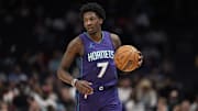 Mar 18, 2025; Charlotte, North Carolina, USA; Charlotte Hornets guard Damion Baugh (7) brings the ball up court against the Atlanta Hawks during second half at Spectrum Center. Mandatory Credit: Jim Dedmon-Imagn Images