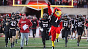 Louisville comes out onto the field before the game against Boston College Saturday night at L&N Stadium