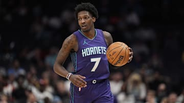 Mar 18, 2025; Charlotte, North Carolina, USA; Charlotte Hornets guard Damion Baugh (7) brings the ball up court against the Atlanta Hawks during second half at Spectrum Center. Mandatory Credit: Jim Dedmon-Imagn Images