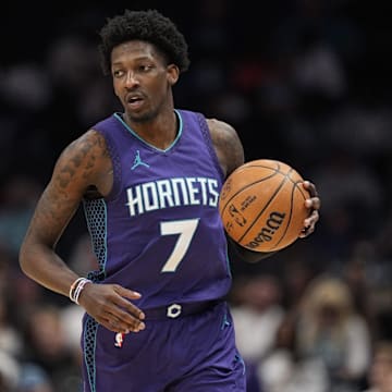 Mar 18, 2025; Charlotte, North Carolina, USA; Charlotte Hornets guard Damion Baugh (7) brings the ball up court against the Atlanta Hawks during second half at Spectrum Center. Mandatory Credit: Jim Dedmon-Imagn Images