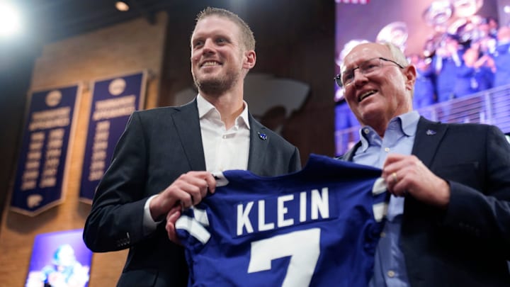 Kansas State new head football coach Collin Klein holds a jersey given by athletic director Gene Taylor during his introduction ceremony at Morgan Family Arena on Dec. 5, 2025.