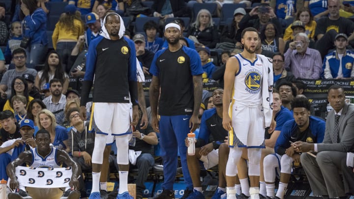 September 29, 2018; Oakland, CA, USA; Golden State Warriors forward Kevin Durant (35), center DeMarcus Cousins (0), and guard Stephen Curry (30) at Oracle Arena.