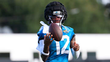 Jacksonville Jaguars wide receiver Travis Hunter (12) plays with the ball during an NFL training camp session at the Miller Electric Center, Sunday, Aug. 3, 2025, in Jacksonville, Fla. [Corey Perrine/Florida Times-Union]