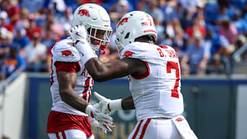 Sep 20, 2025; Memphis, Tennessee, USA; Arkansas Razorbacks linebacker Xavian Sorey Jr. (10) and linebacker Bradley Shaw (7) celebrate a defensive stop during the first half against the Memphis Tigers at Simmons Bank Liberty Stadium. Mandatory Credit: Wesley Hale-Imagn Images