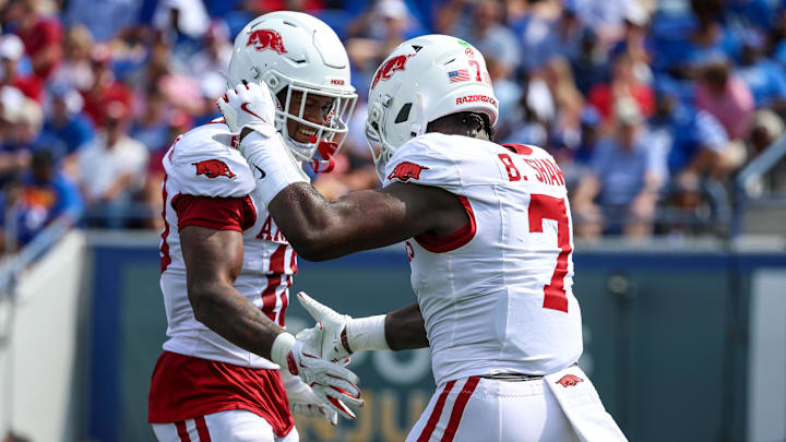 Sep 20, 2025; Memphis, Tennessee, USA; Arkansas Razorbacks linebacker Xavian Sorey Jr. (10) and linebacker Bradley Shaw (7) celebrate a defensive stop during the first half against the Memphis Tigers at Simmons Bank Liberty Stadium. Mandatory Credit: Wesley Hale-Imagn Images