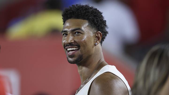Sep 12, 2025; Houston, Texas, USA; Philadelphia 76ers player Quentin Grimes smiles while watching the game between the Houston Cougars and the Colorado Buffaloes at TDECU Stadium. Mandatory Credit: Troy Taormina-Imagn Images