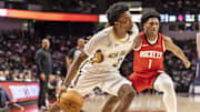 Oct 14, 2025; Birmingham, Alabama, USA; New Orleans Pelicans forward Herb Jones (2) works past Houston Rockets guard-forward Amen Thompson (1) during an NBA preseason game at Legacy Arena at BJCC. Mandatory Credit: Vasha Hunt-Imagn Images