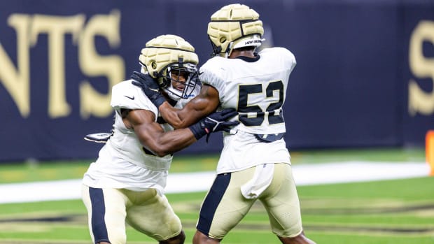 New Orleans Saints linebackers D'Marco Jackson (52) and Anfernee Orji (58) work on defensive back drills during training camp