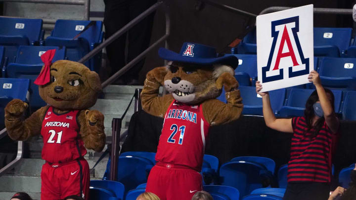 Apr 2, 2021; San Antonio, Texas, USA; Arizona Wildcats mascot Wilbur and Wilma hold U of A signs during the game against the Connecticut Huskies at Alamodome. Arizona defeated UConn 69-59. Mandatory Credit: Kirby Lee-USA TODAY Sports