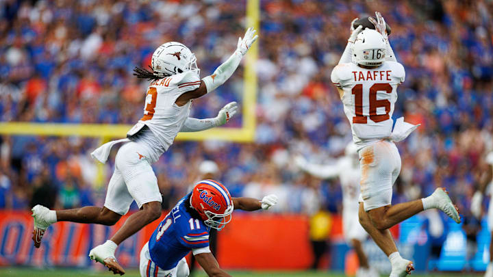 Oct 4, 2025; Gainesville, Florida, USA; Texas Longhorns defensive back Michael Taaffe (16) intercepts a pass to Florida Gators wide receiver Aidan Mizell (11) during the second half at Ben Hill Griffin Stadium. Mandatory Credit: Matt Pendleton-Imagn Images Oct 4, 2025; Gainesville, Florida, USA; Texas Longhorns defensive back Michael Taaffe (16) intercepts a pass to Florida Gators wide receiver Aidan Mizell (11) during the second half at Ben Hill Griffin Stadium. Mandatory Credit: Matt Pendleton-Imagn Images