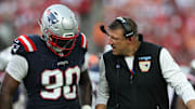 Nov 9, 2025; Tampa, Florida, USA; New England Patriots defensive tackle Christian Barmore (90) talks with head coach Mike Vrabel during the third quarter against the Tampa Bay Buccaneers at Raymond James Stadium. Mandatory Credit: Nathan Ray Seebeck-Imagn Images