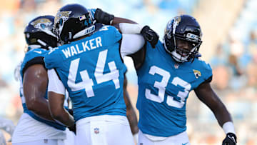 Jacksonville Jaguars linebacker Travon Walker (44) greets linebacker Devin Lloyd (33) before the game of a preseason matchup Saturday, Aug. 26, 2023 at EverBank Stadium in Jacksonville, Fla. [Corey Perrine/Florida Times-Union]