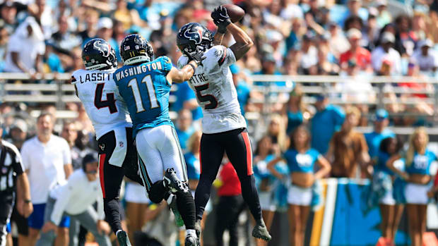 Houston Texans safety Jalen Pitre (5) collects an interception during the fourth quarter of an NFL football matchup at EverBa