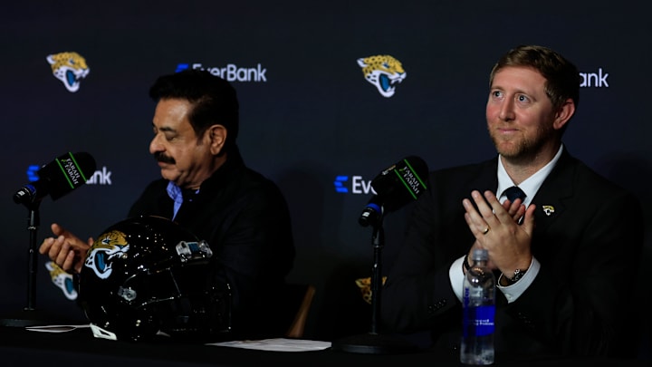New Jacksonville Jaguars head coach Liam Coen, right, claps next to Jaguars owner Shad Khan after speaking and being introduced during a press conference Monday, Jan. 27, 2025 at the Miller Electric Center in Jacksonville, Fla. 