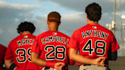 Boston's top-three prospects in Marcelo Mayer, Kristian Campbell and Roman Anthony stand for the national anthem ahead of a Spring Training breakout game on March 13, 2025.