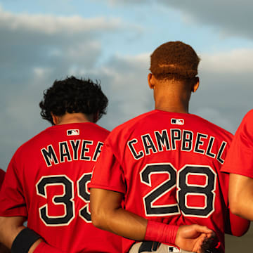 Boston's top-three prospects in Marcelo Mayer, Kristian Campbell and Roman Anthony stand for the national anthem ahead of a Spring Training breakout game on March 13, 2025.