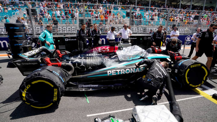 May 4, 2024; Miami Gardens, Florida, USA; Crewmembers of the Mercedes driver George Russell (63) cool the car on the grid before the F1 Sprint Race at Miami International Autodrome. Mandatory Credit: John David Mercer-USA TODAY Sports