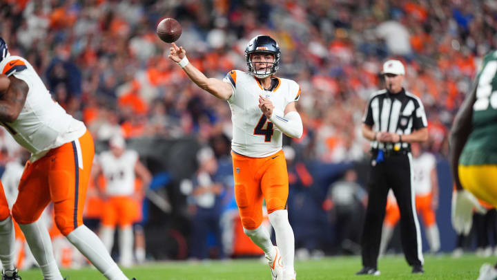 Aug 18, 2024; Denver, Colorado, USA; Denver Broncos quarterback Zach Wilson (4) passes the ball in the second half against the Green Bay Packers at Empower Field at Mile High.