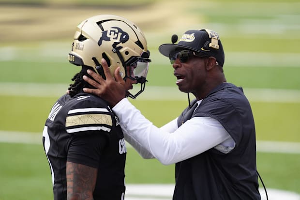 Aug 29, 2025; Boulder, Colorado, USA; Colorado Buffaloes head coach Deion Sanders congratulates Colorado Buffaloes quarterbac