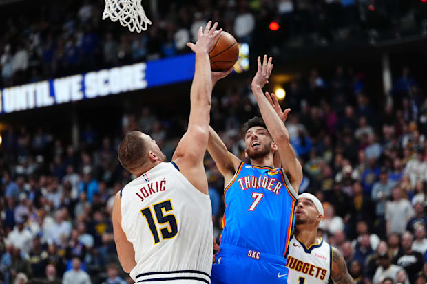 Denver Nuggets center Nikola Jokic (15) defends on Oklahoma City Thunder forward Chet Holmgren (7)