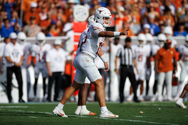 Texas Longhorns quarterback Arch Manning gestures