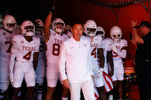 Texas head coach Steve Sarkisian leads the team out of the tunnel before a game against Florida.