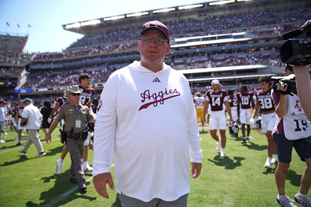 Texas A&M Aggies head coach Mike Elko leaves the field following a 52-10 win against the McNeese State Cowboys at Kyle Field.