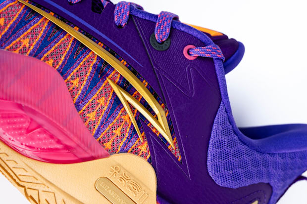 Side of Kyrie Irving's purple and gold sneakers.