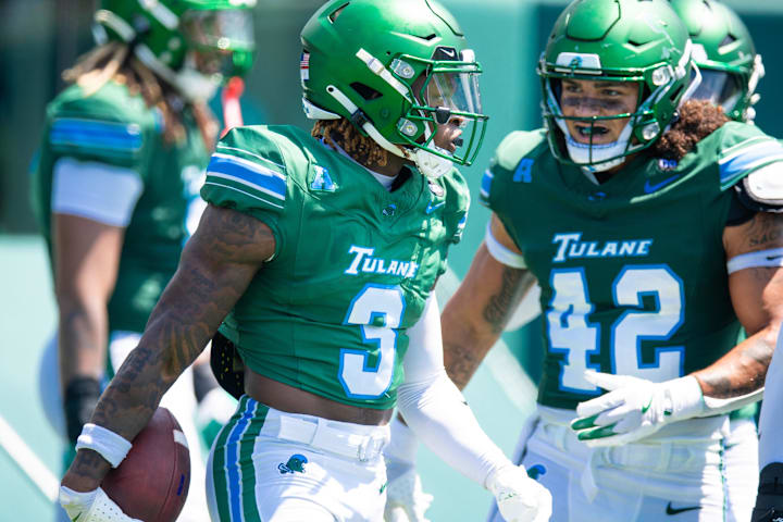 Tulane Green Wave defensive back Javion White intercepts a pass from Northwestern Wildcats quarterback Preston Stone. 