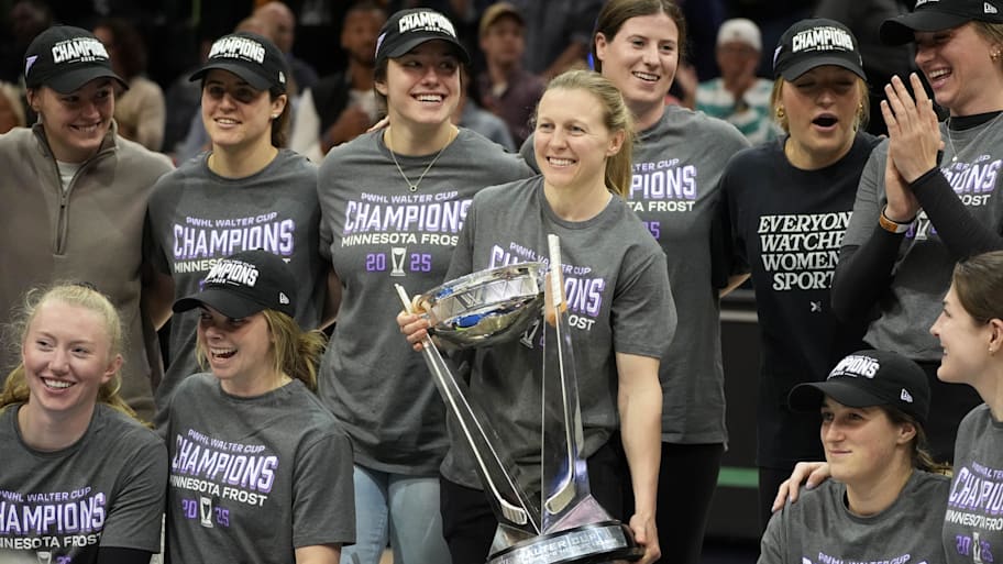Minnesota Frost captain Kendall Coyne Schofield joined by her teammates carries the Walter Cup